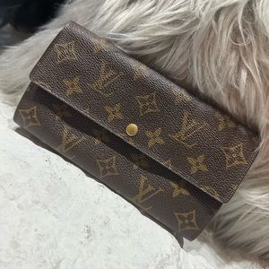 Authentic Louis Vuitton Sarah wallet.